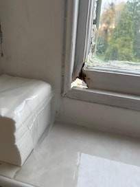 Hole in rotten window frame