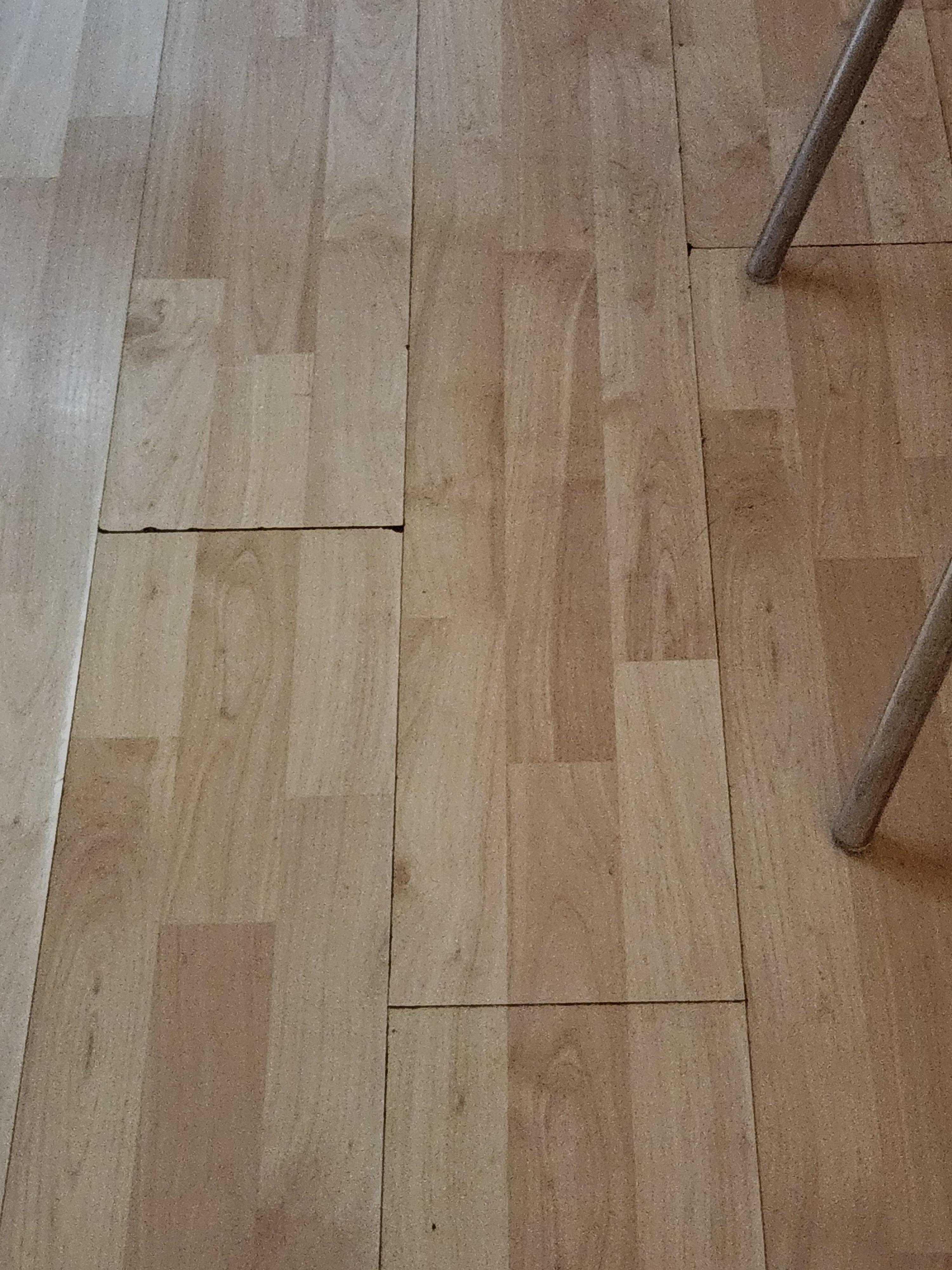 Laminate floor buckled due to water damage. 