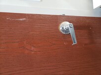 Door handle askew and random construction glue on door