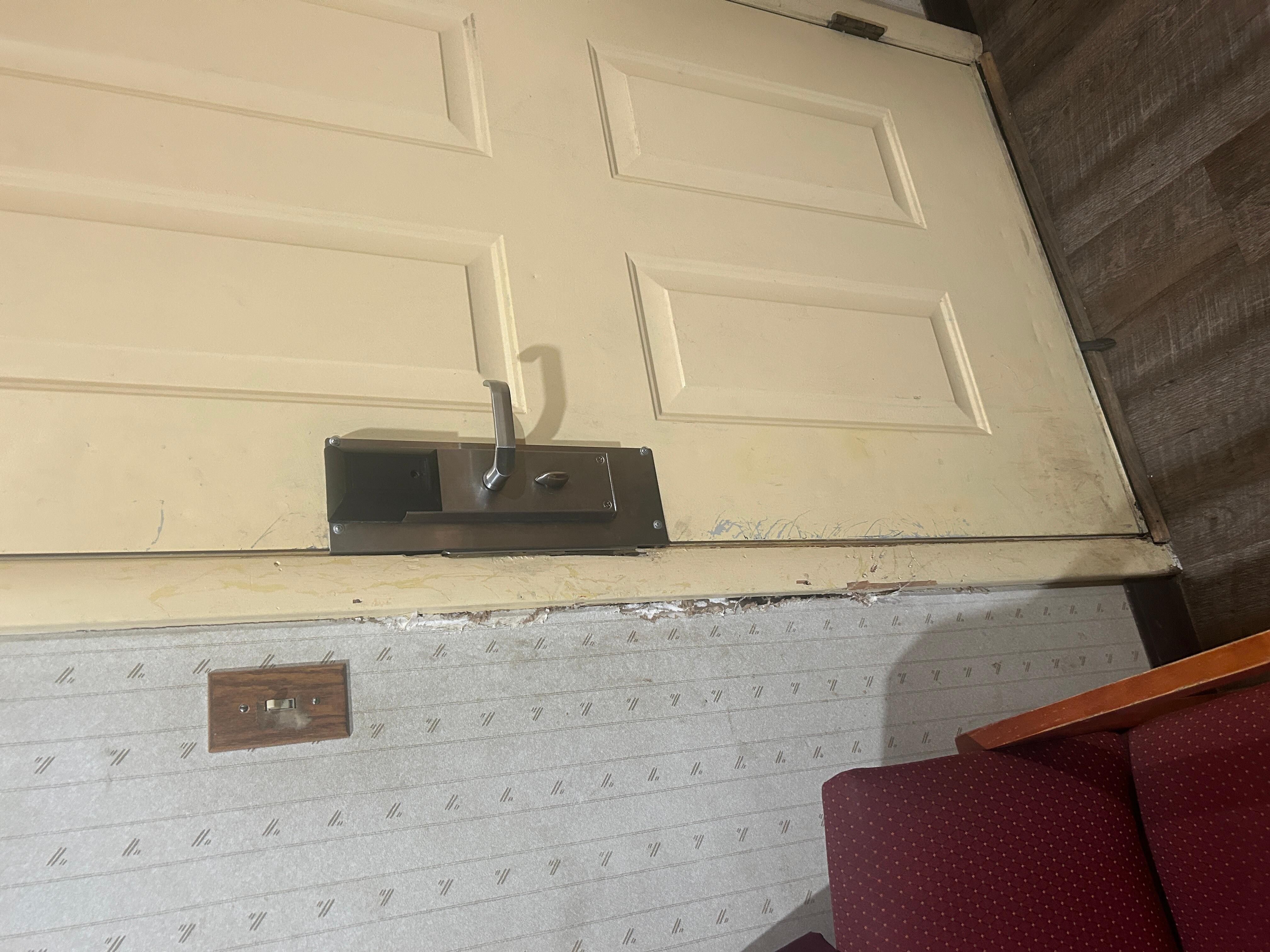 Wall damaged by door probably by a dog