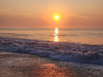 Sunrise on the beach by the condo