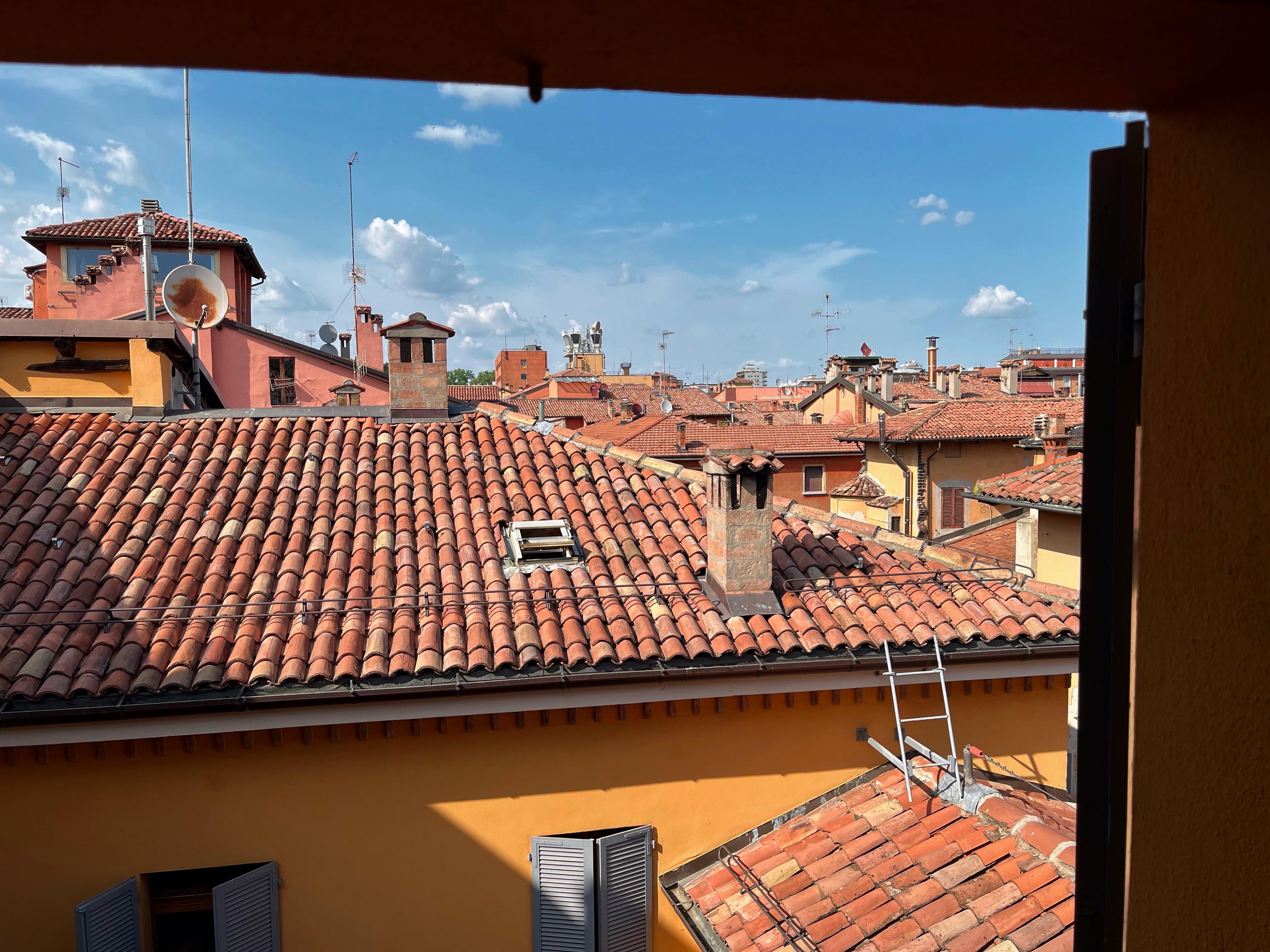 View of Bologna’s red roofs from bedroom 