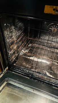 The dirty oven upon arrival
