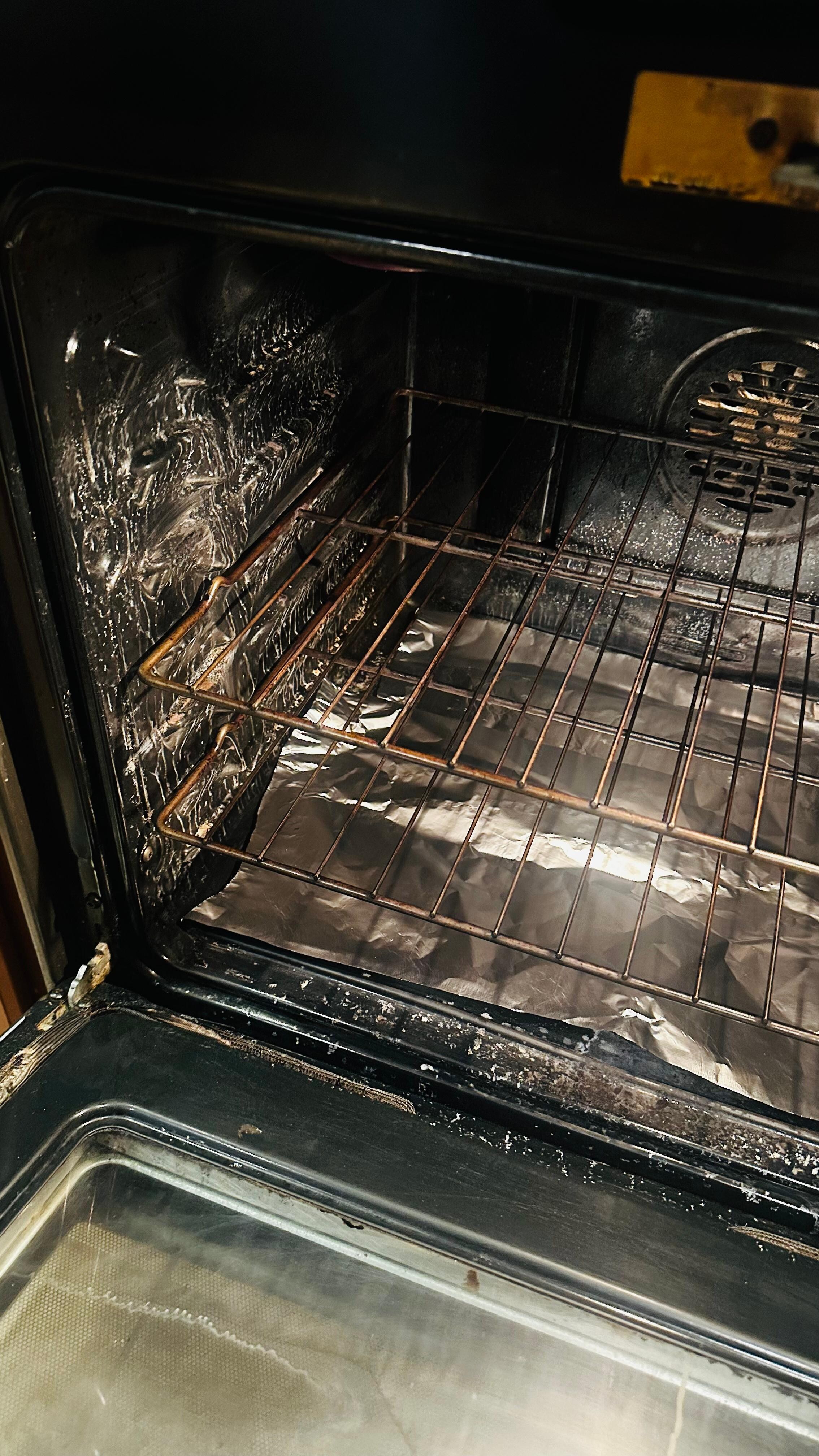 The dirty oven upon arrival