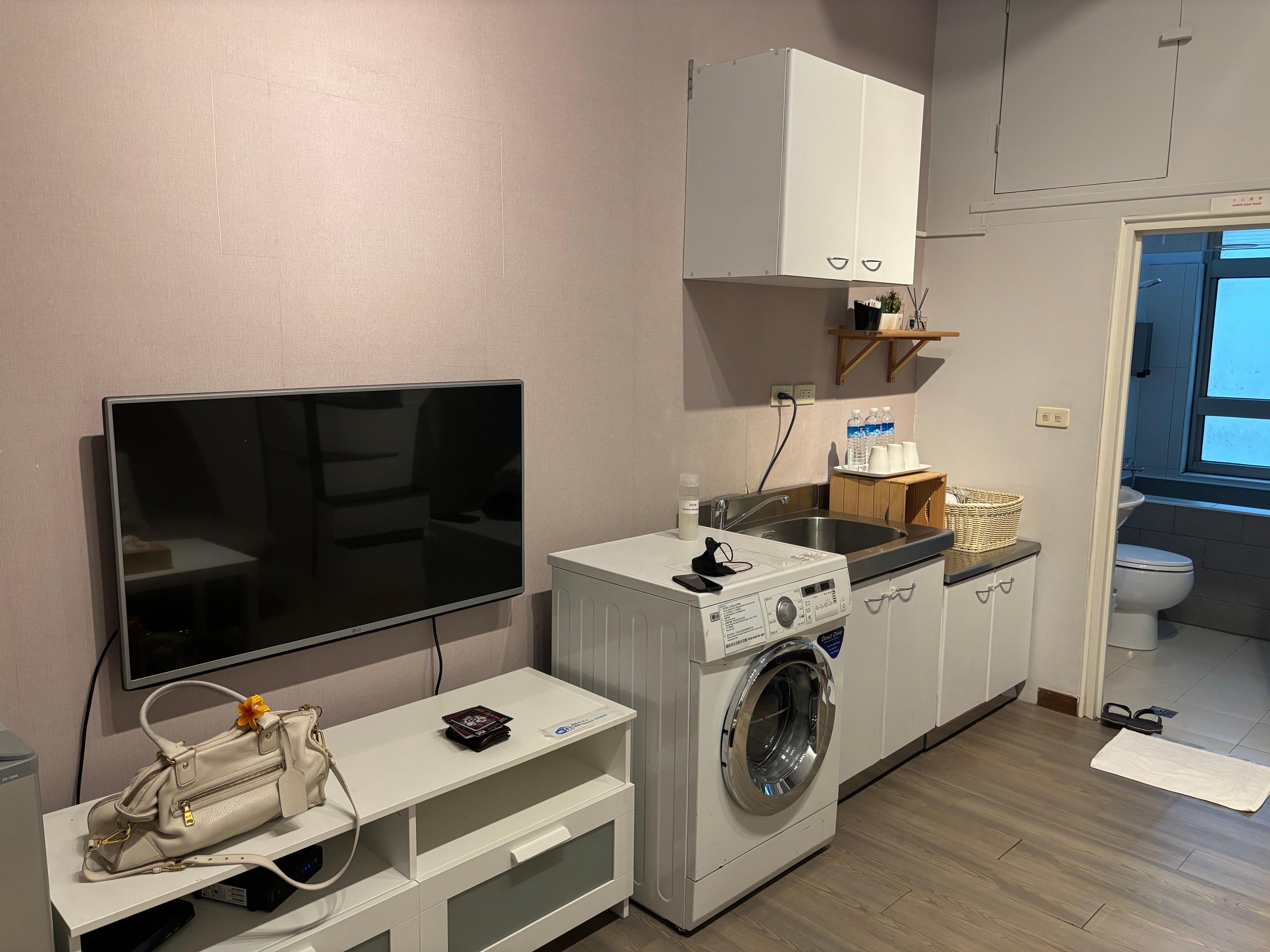 Washing area with small kitchenette.