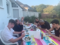 Enjoying a fish barbecue in the garden. Delicious fish bought from the local market.