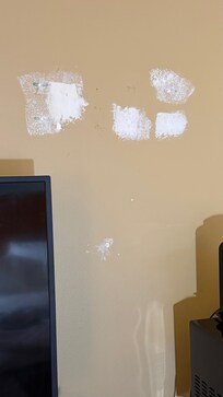 The wall above the tv