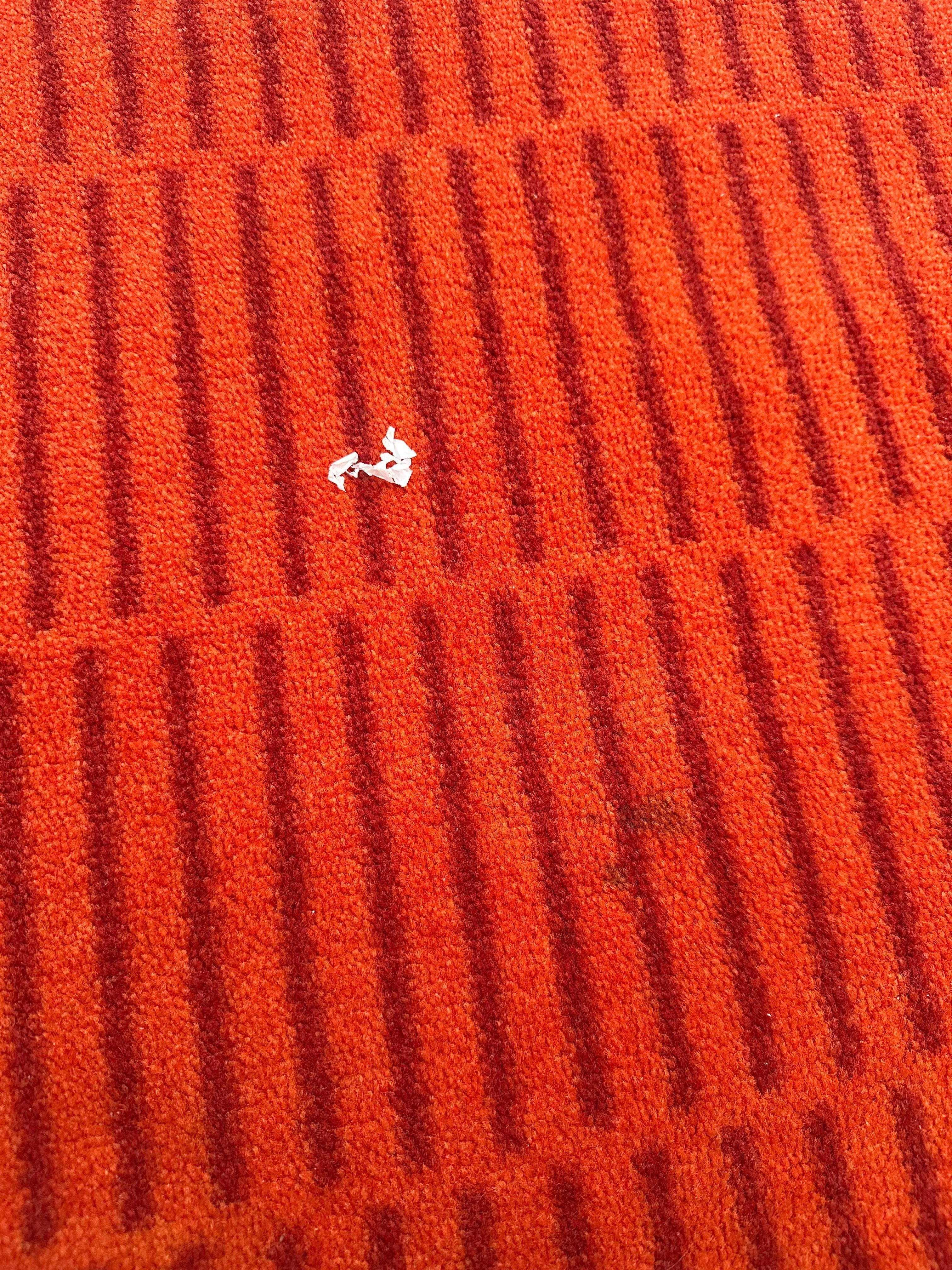Stained carpet and tissue on the carpet.
