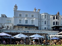 Back of hotel which overlooks the beach. Very popular with queues to get in during music festival