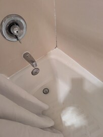 Tub was dripping all night, causing a small pool of water in it.