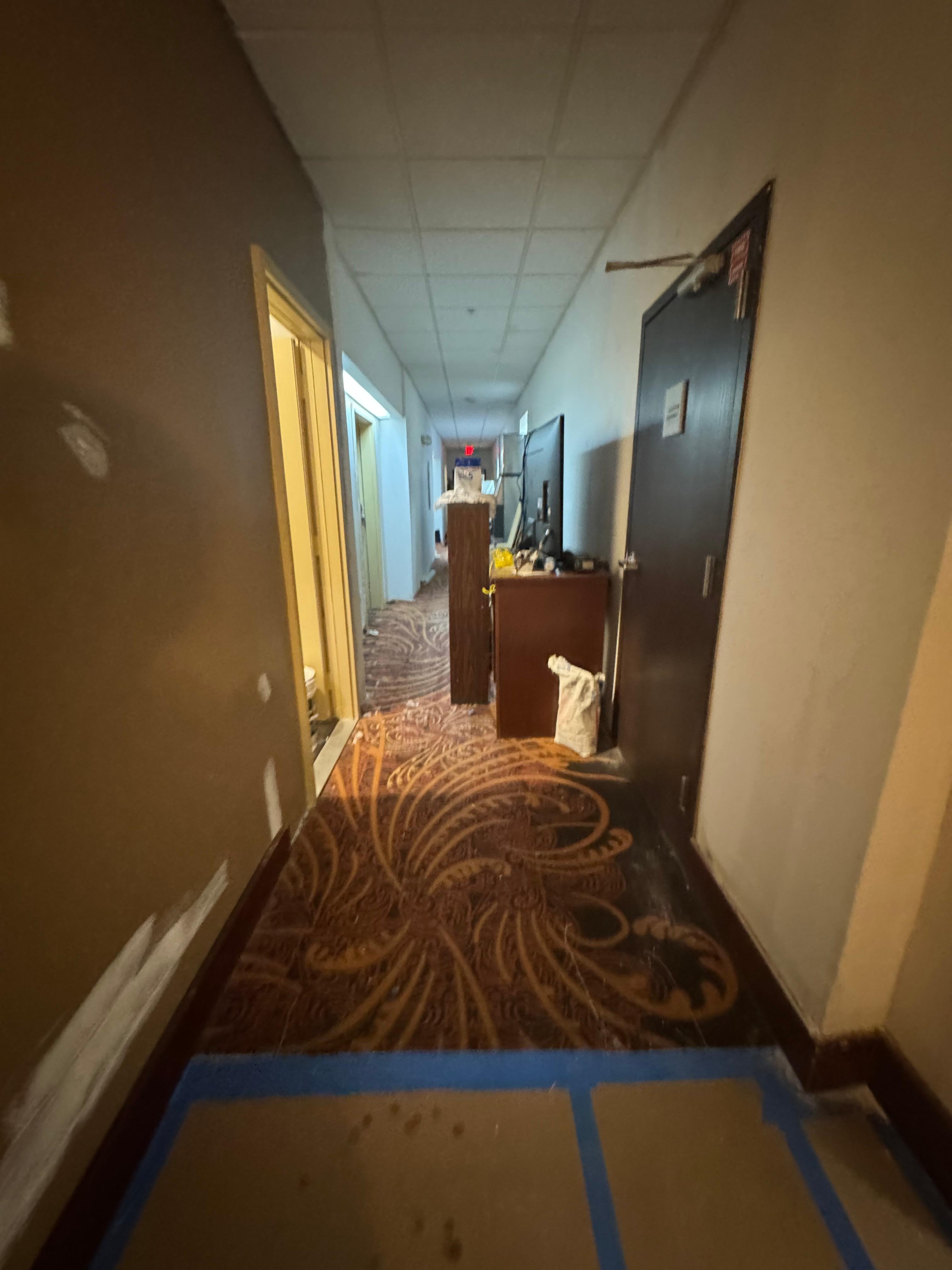 Hallway to get to the elevator. 