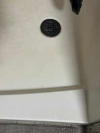 Soap scum and hair in upstairs bathroom