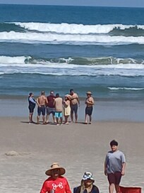 Friends thinking about going in the water it was cold 🥶