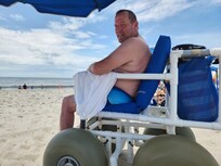 Dave on his beach wheelchair. He was so glad for that.