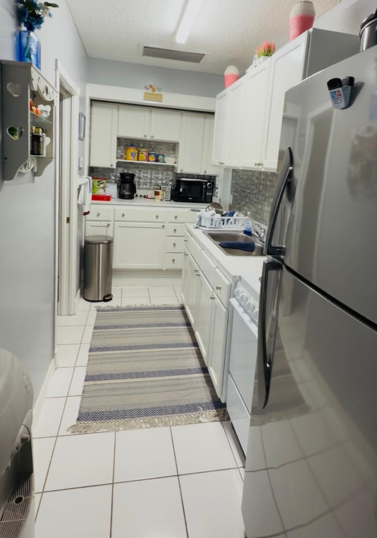 Walking into the kitchen from living room