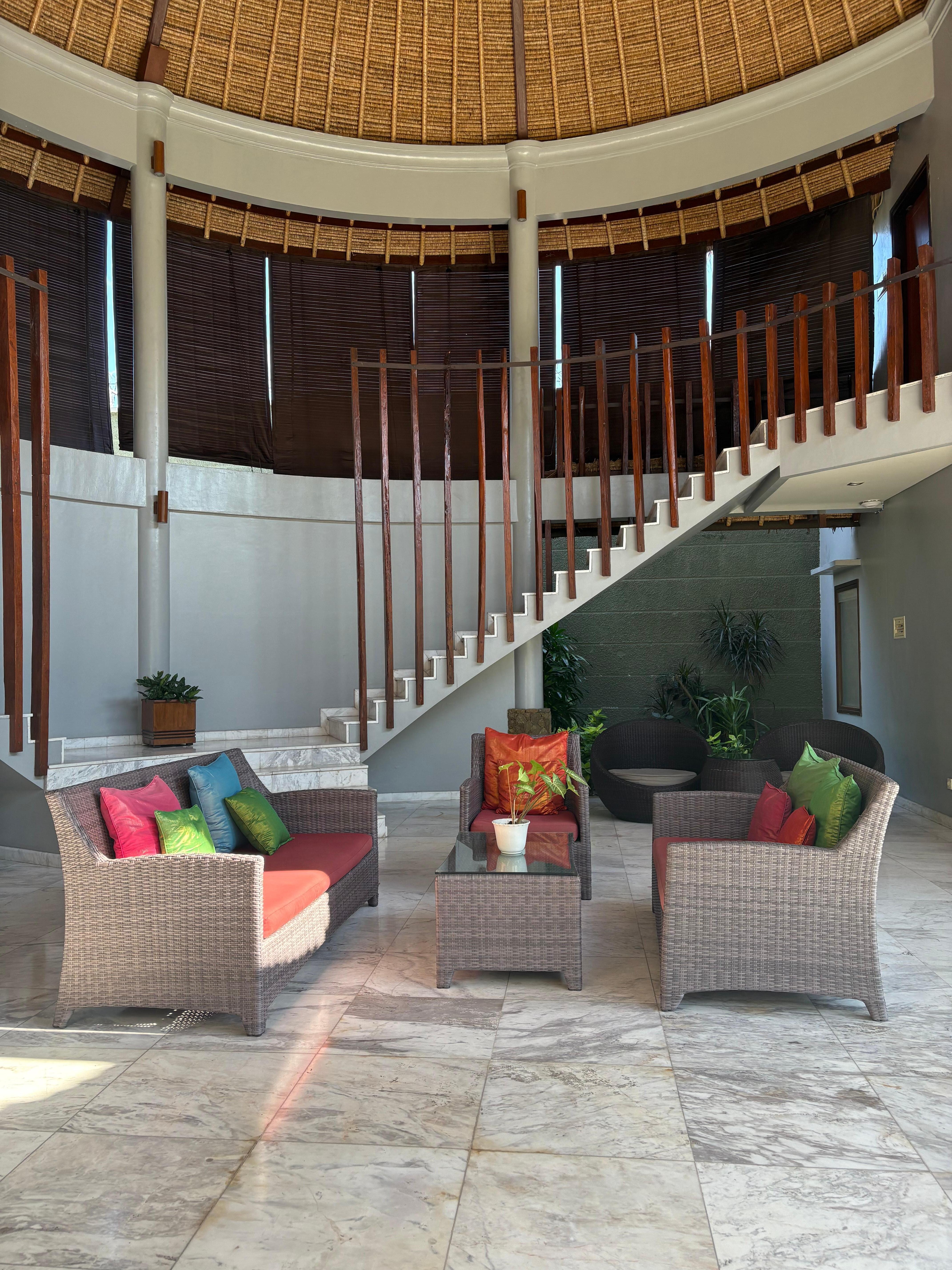 outdoor sitting area with a pool shared between 4 suites