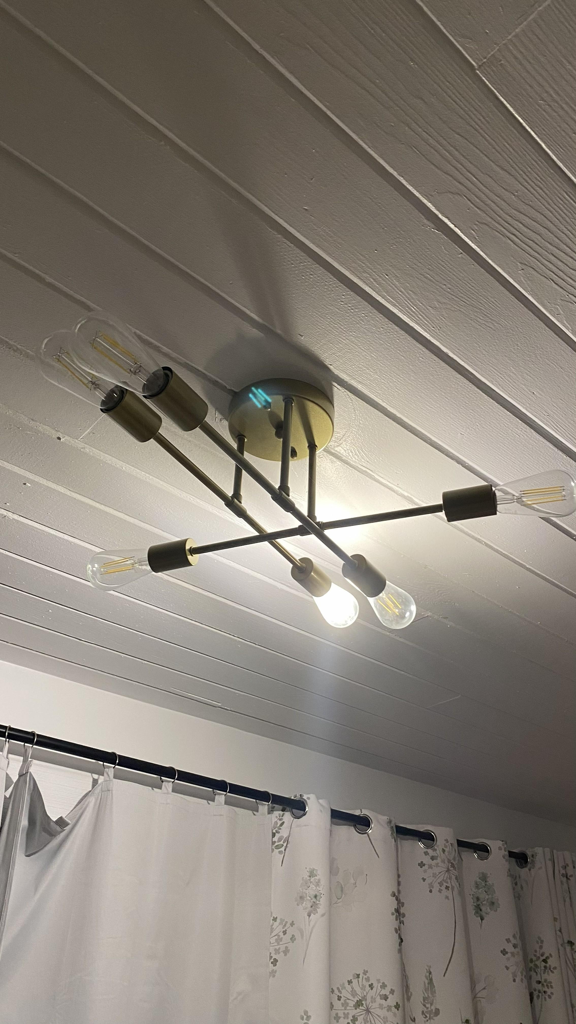 The only light fixture in the room with two queens and only one bulb worked.