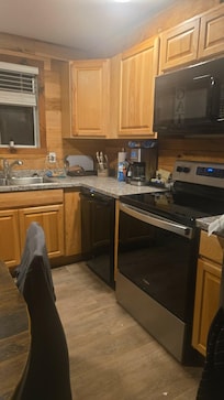 Kitchen with dishwasher and full fridge