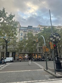 Looking at building from across the street. Apartment is right half of top floor, plus terrace above