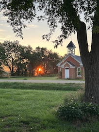 Sunrise over the old schoolhouse across from the Limestone Castle