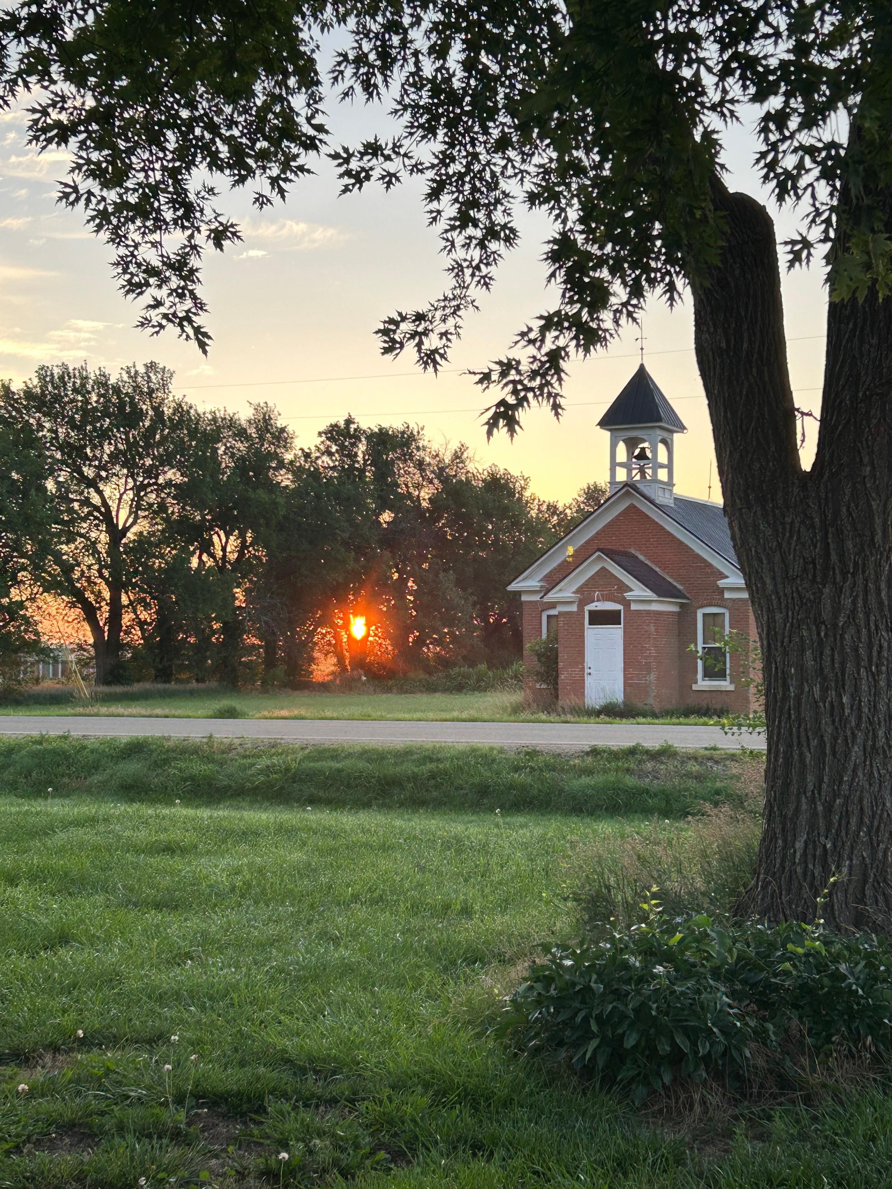 Sunrise over the old schoolhouse across from the Limestone Castle