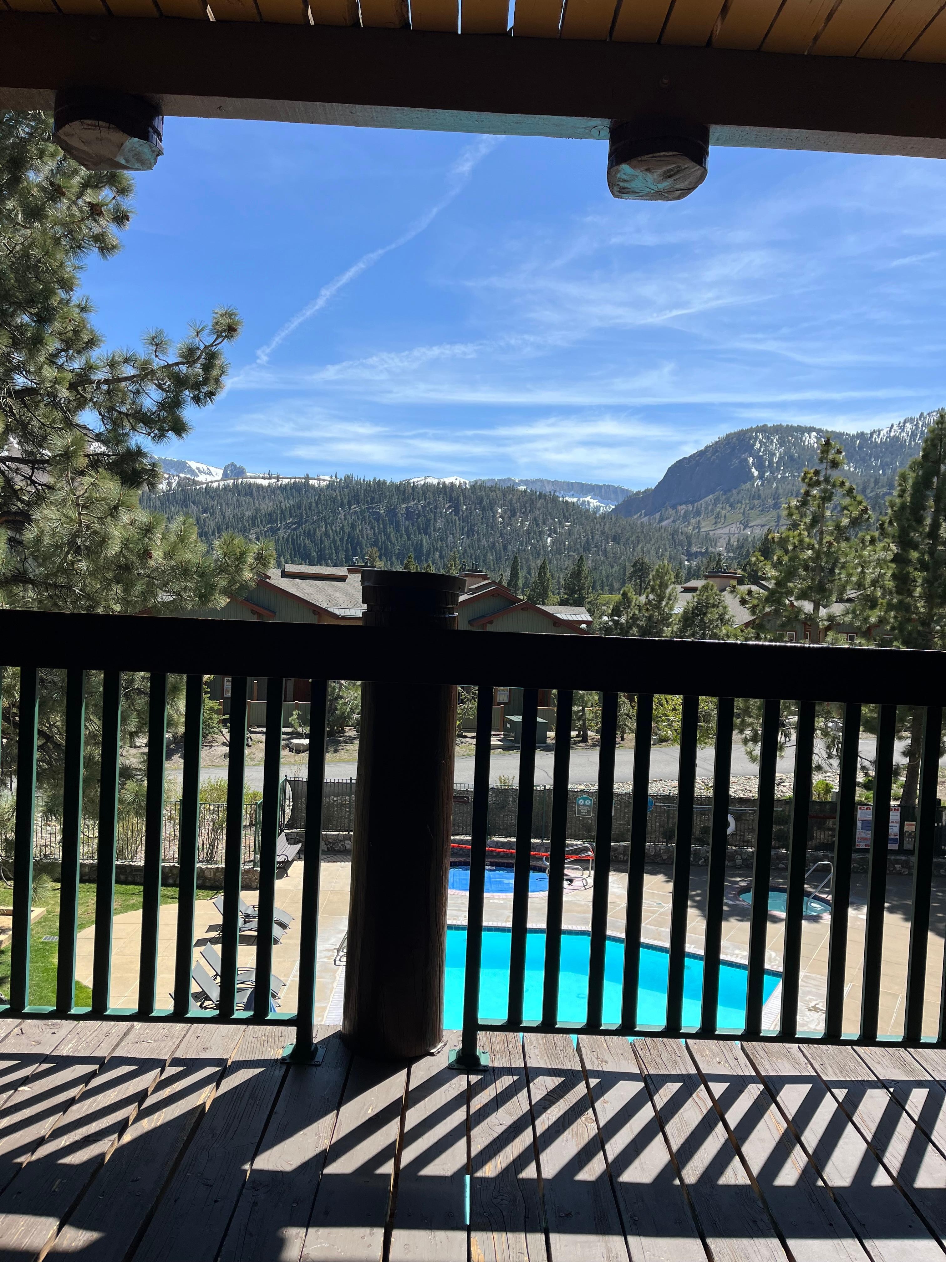 View from room patio overlooking pool & hot tub; great for relaxing and enjoying the view of mammoth mountain.