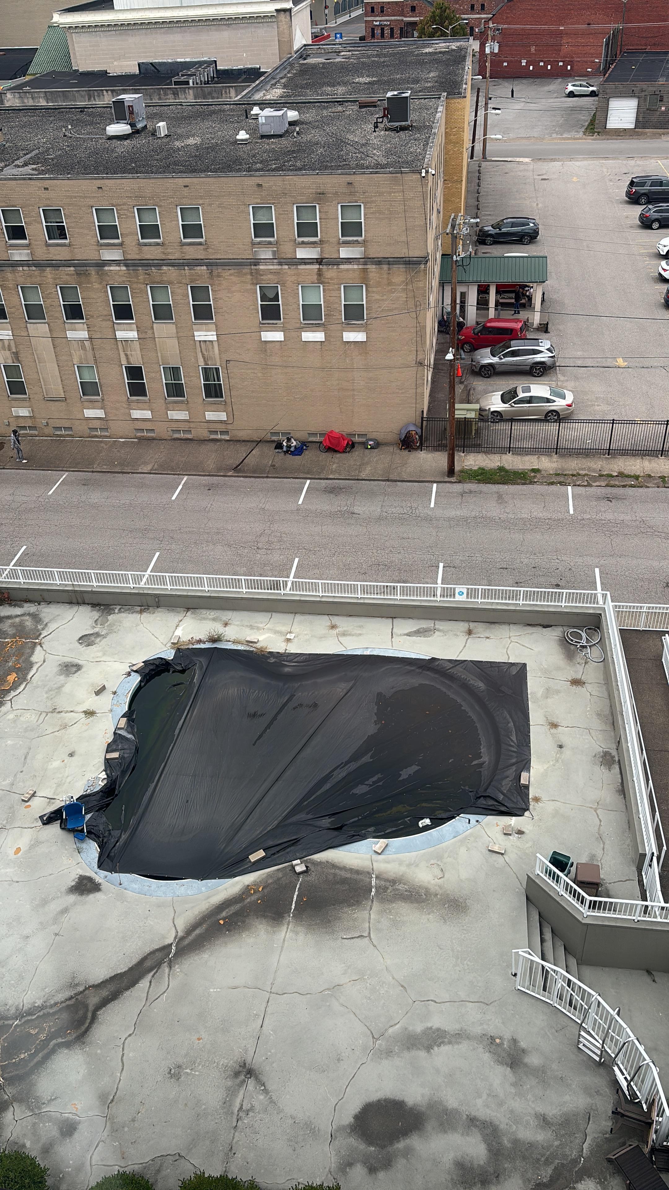 The hotel can't resolve the problem of homeless people or the area but worth mentioning.  View from 8th floor window. Pool covered.