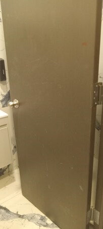 Filthy bathroom door in rm #3