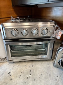Dining area plenty large, allowing for family gathering. One oven and this small convection counter oven.