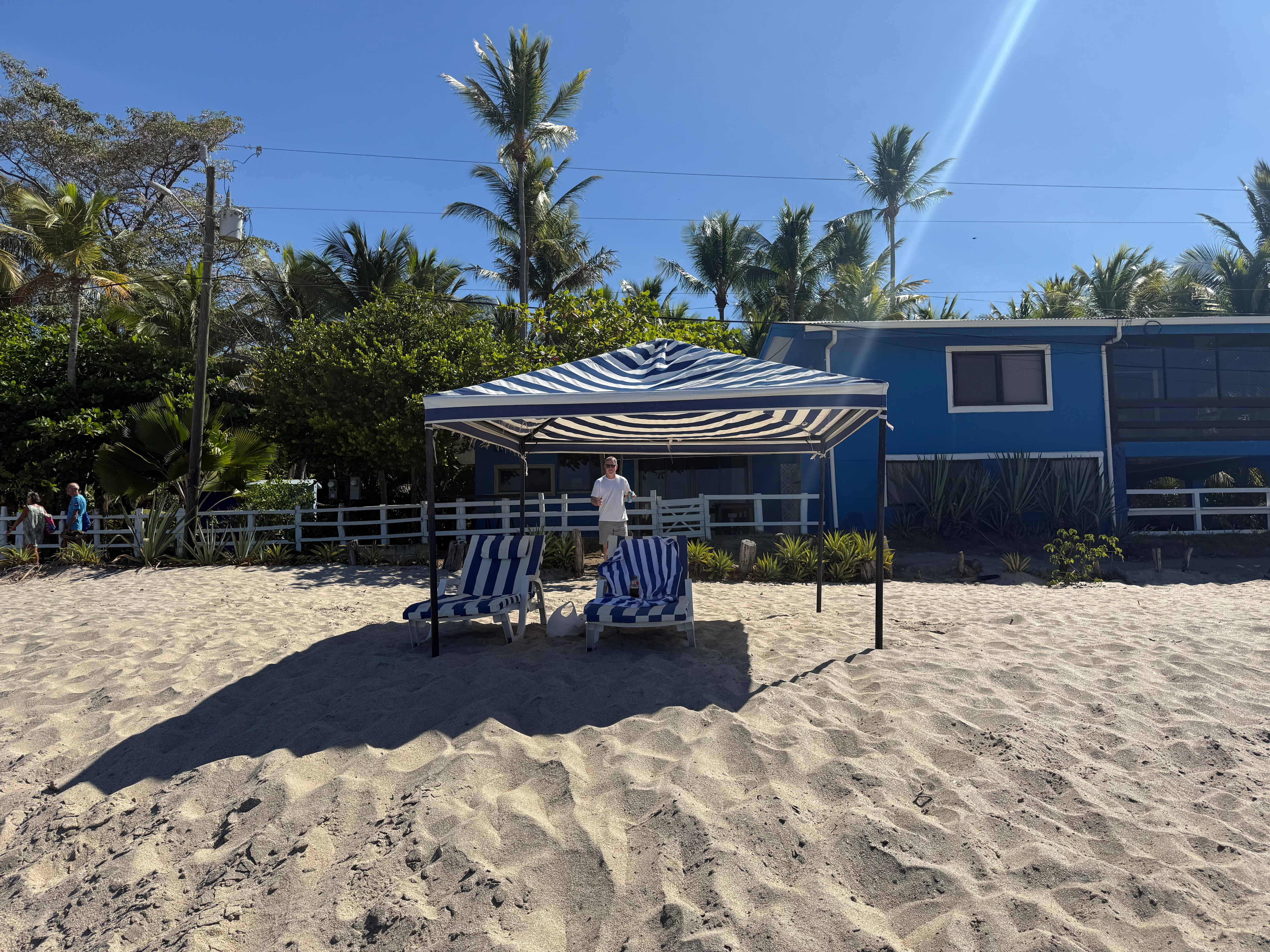 View of the house from the beach. The cabana and beach chairs are for the use of the studio guests.