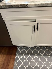 Kitchen cabinet door with broken hinge