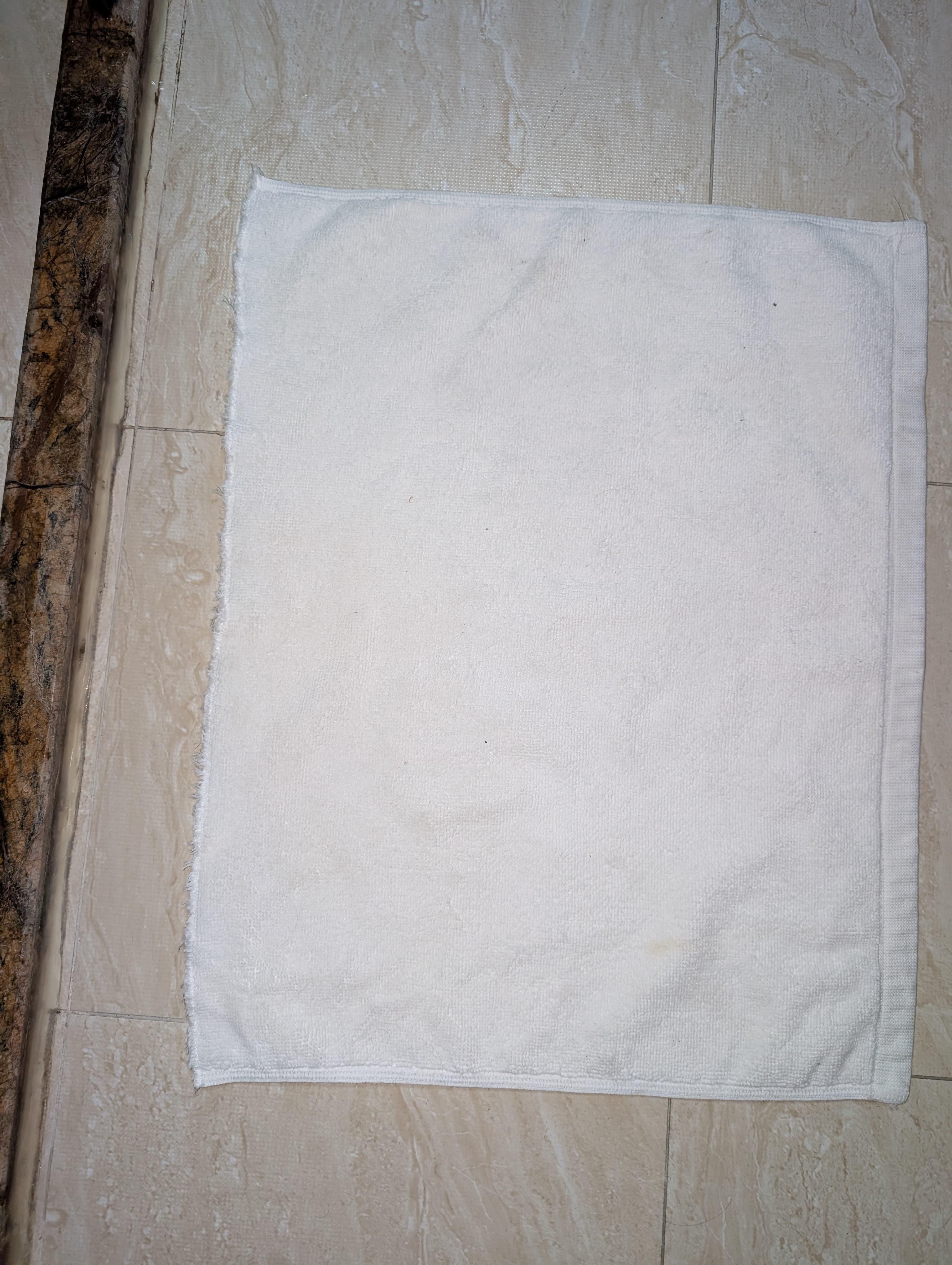 Bath mat was a towel cut in half with scissors