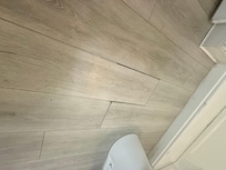 Flooring in bathroom needs replacing.