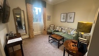 Small room to flop in. Would be nice to share a glass of wine together, separate from the bedroom.