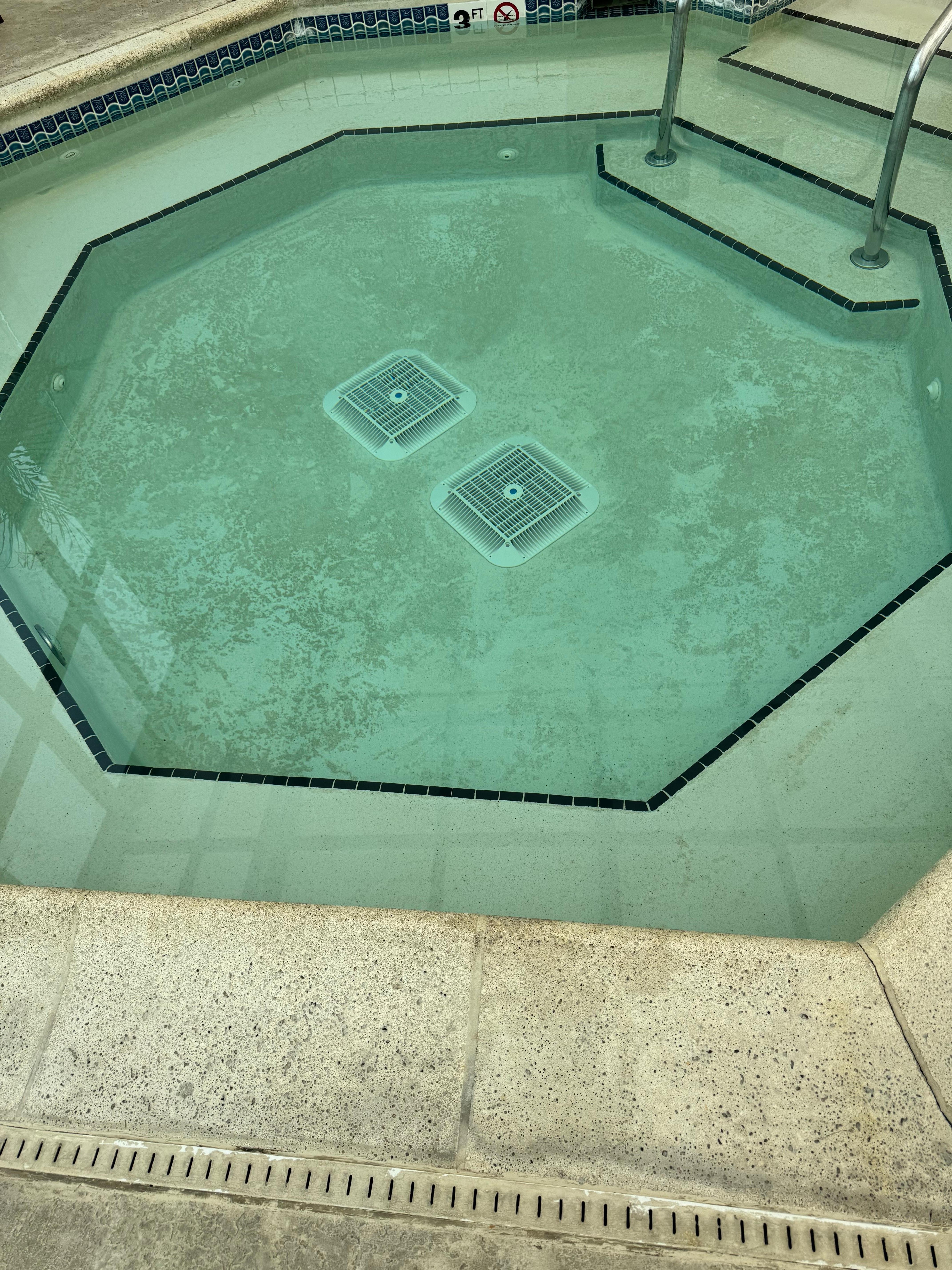 This is dirt on the bottom of hot tub floor