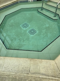 This is dirt on the bottom of hot tub floor
