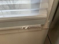 There was a problem with the refrigerator door being oriented the wrong way, which hit the blinds.