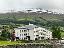 Snowy mountains behind the hotel in late May