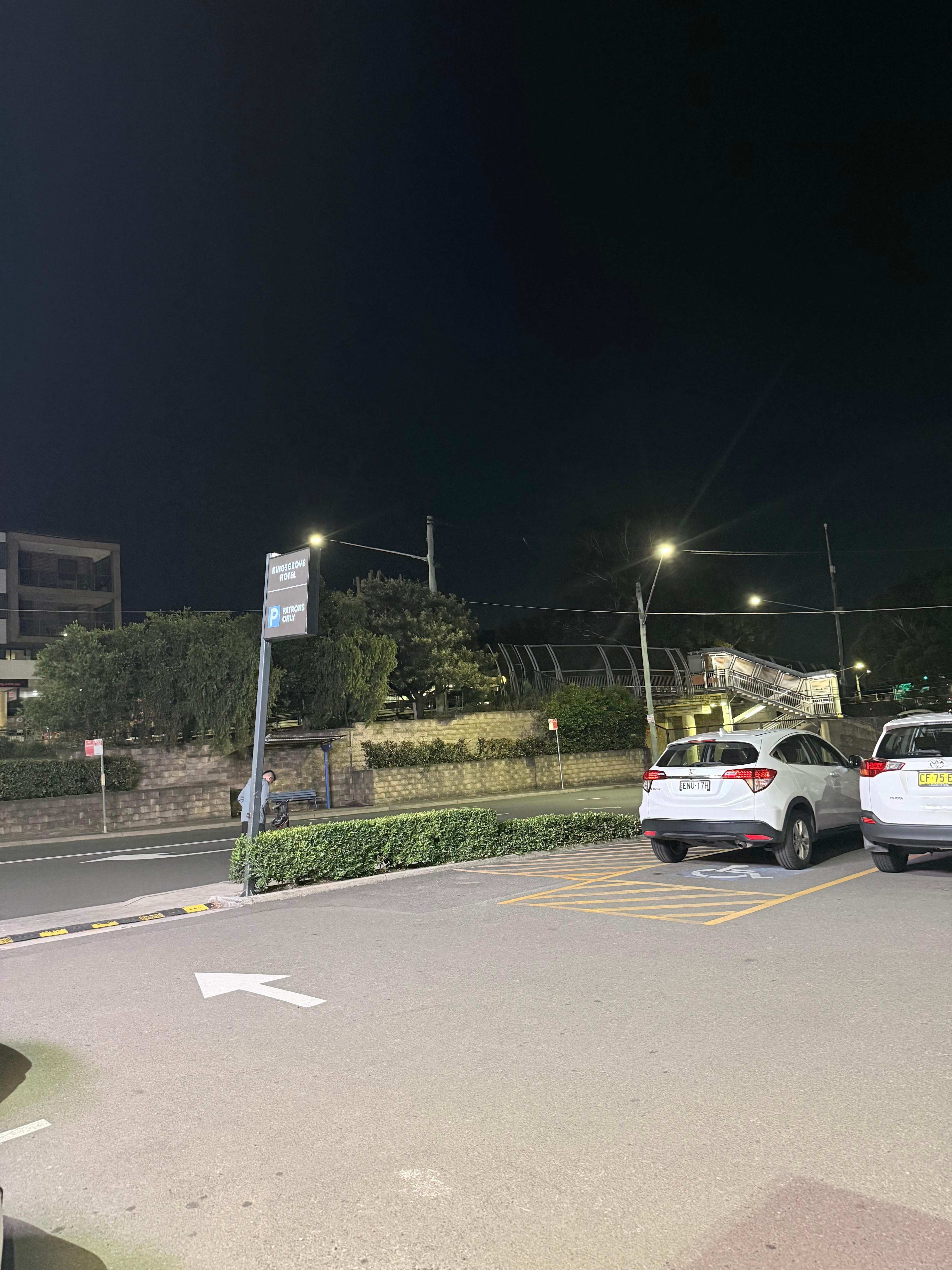 Arrow pointing bus stop and train station 