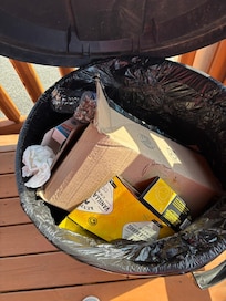 Front porch garbage can was full upon arrival.