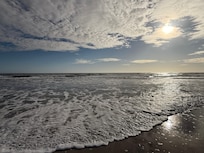 Beach, accessed from the property. Short walk.