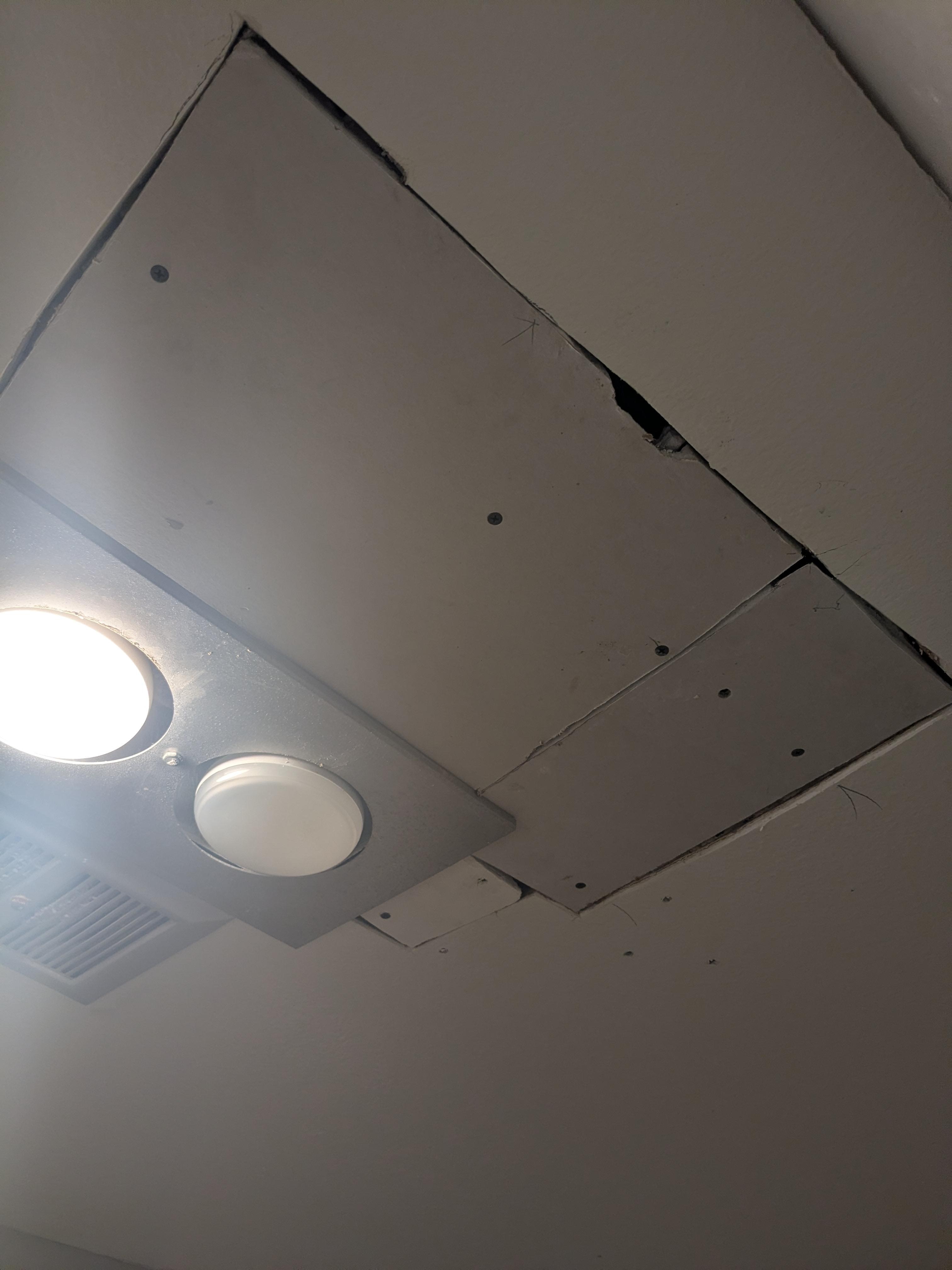 Poorly done repairs in bathroom.