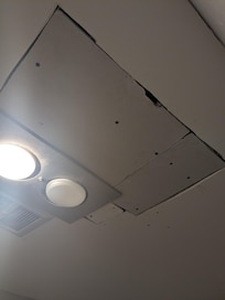 Poorly done repairs in bathroom.