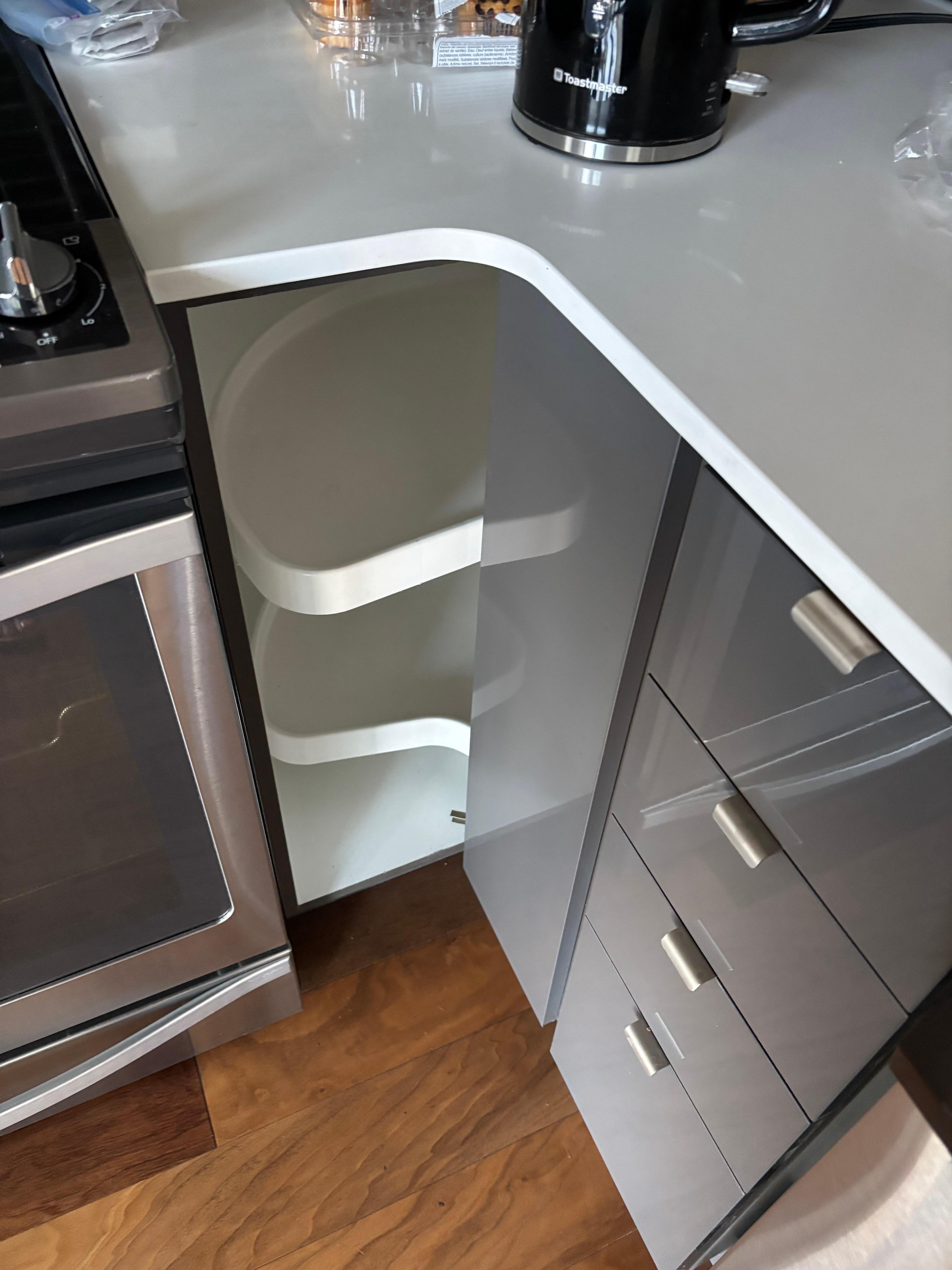 Opened corner cupboard looking for pans and door fell off. It appeared to have been left  “propped” into place. (Was not attached) 