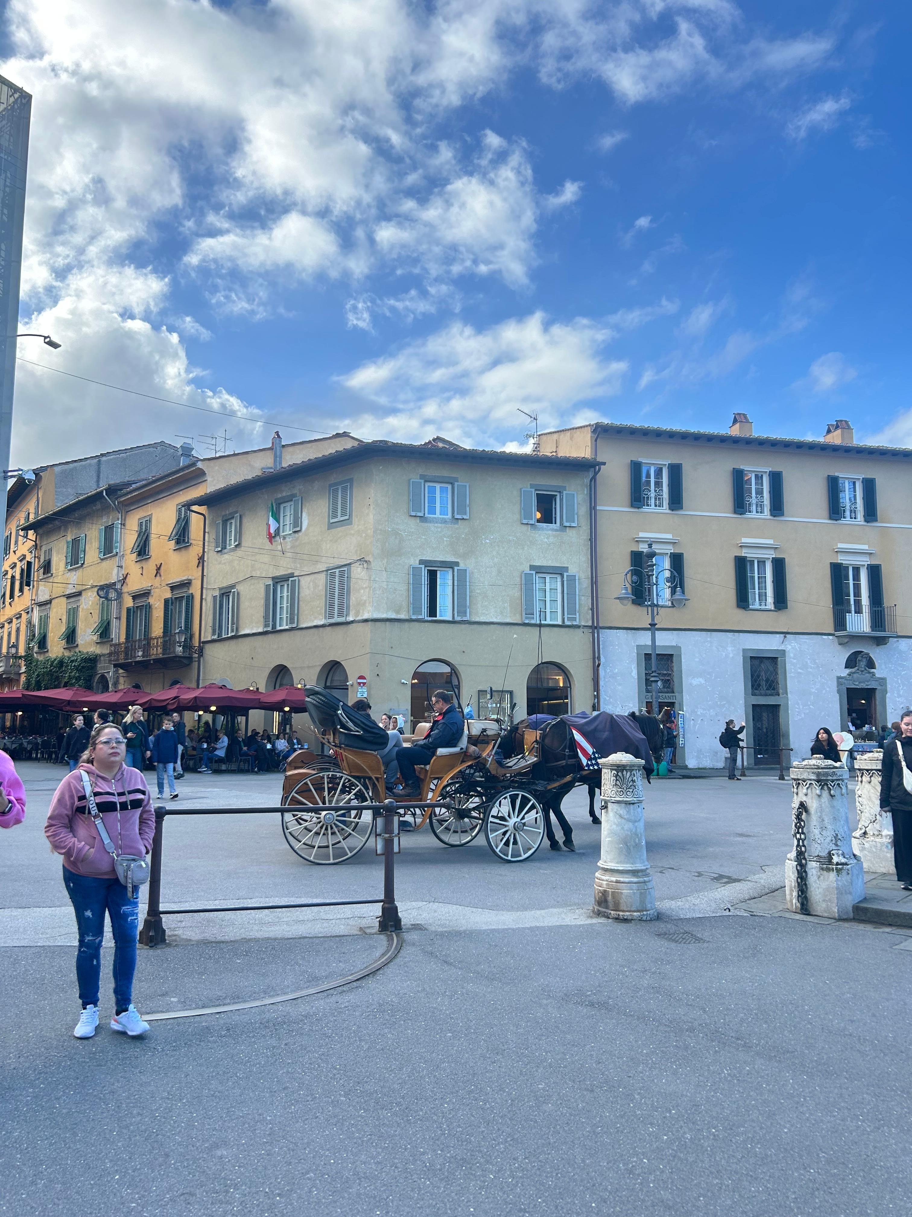 Rooms are on the 1st and 2nd floor of the corner building. If faces the square just in front of the Pisa tower.  I’m standing by the tower taking this photo. 