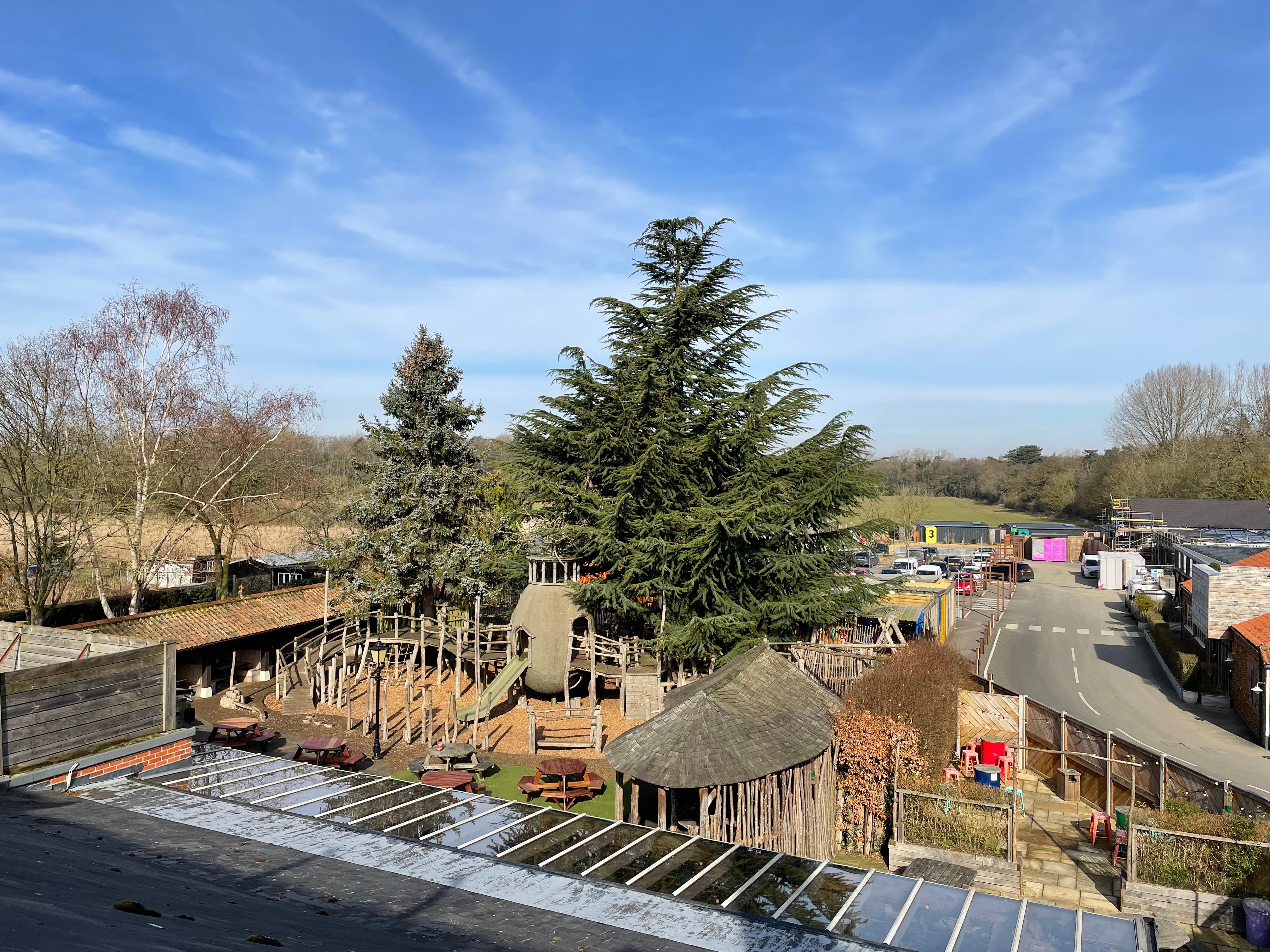 Parking area, container golf, garden children’s woodland area.