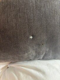 Cigarette burn hole