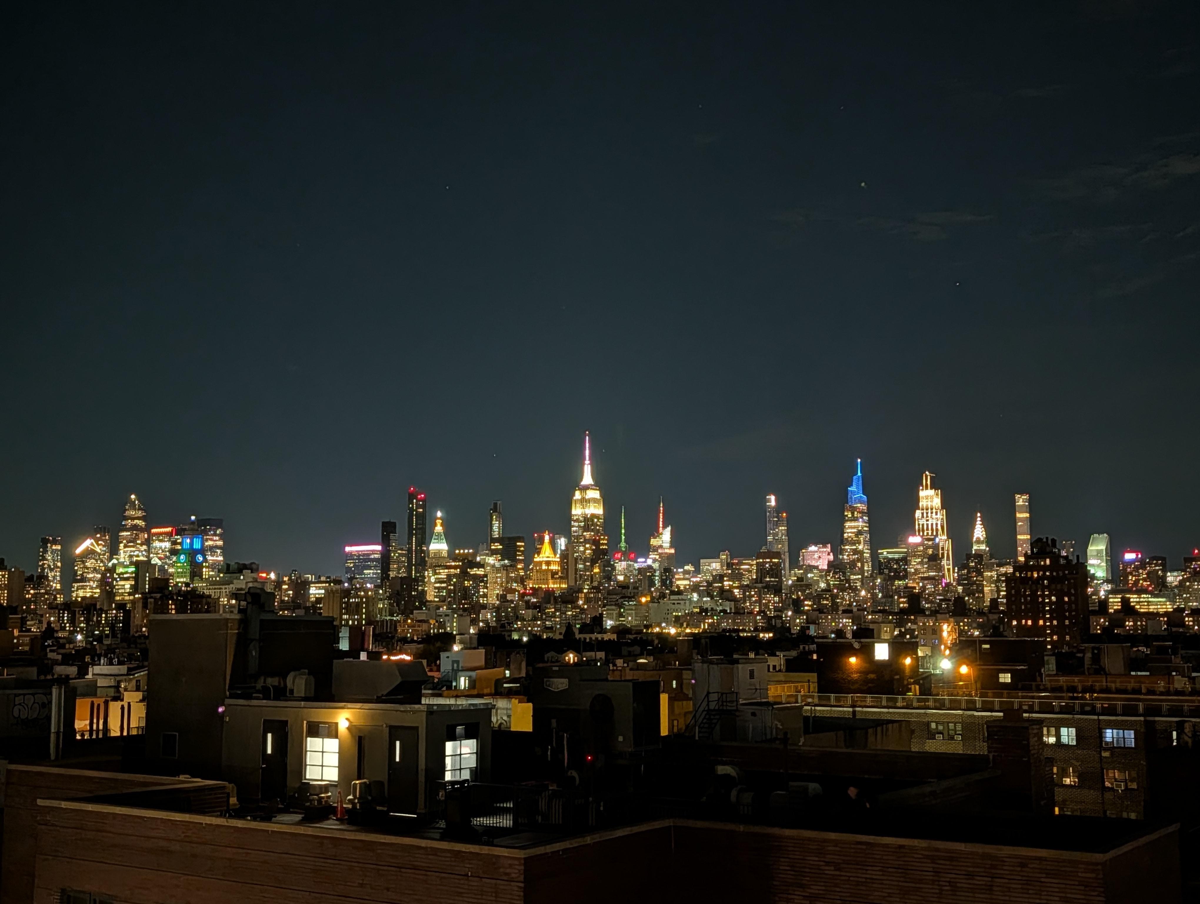 Nighttime view from the rooftop deck looking uptown