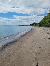 Beach, pebbled.
Nice walk towards tall dunes.
