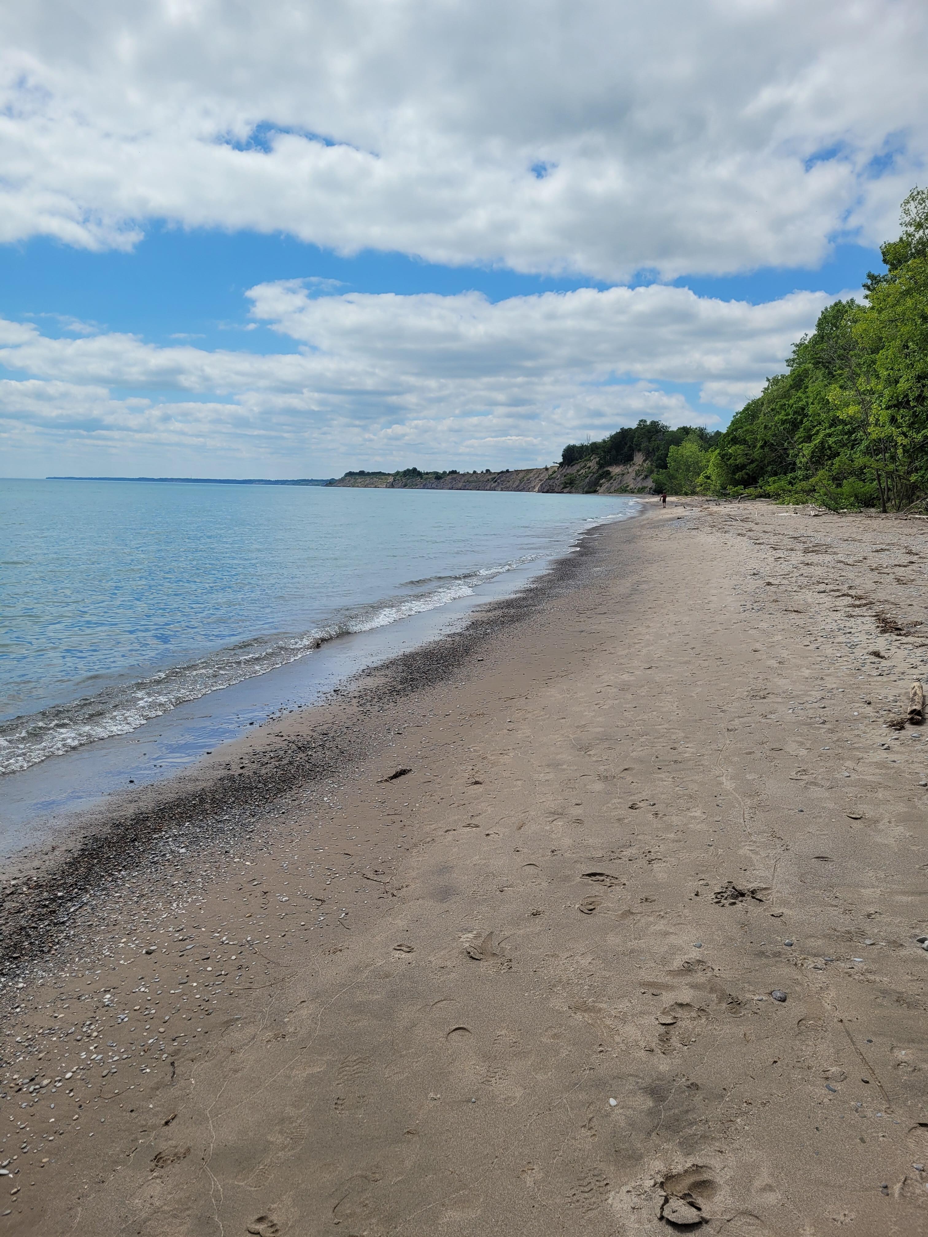 Beach, pebbled.
Nice walk towards tall dunes.